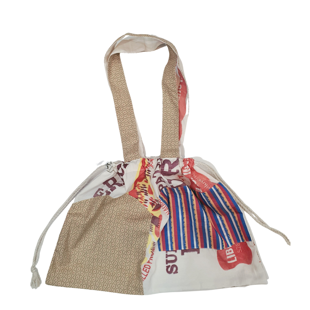 The Marlena Pouch Bag: Large katsa pouch bag in colourful stripes and beige print fabric.