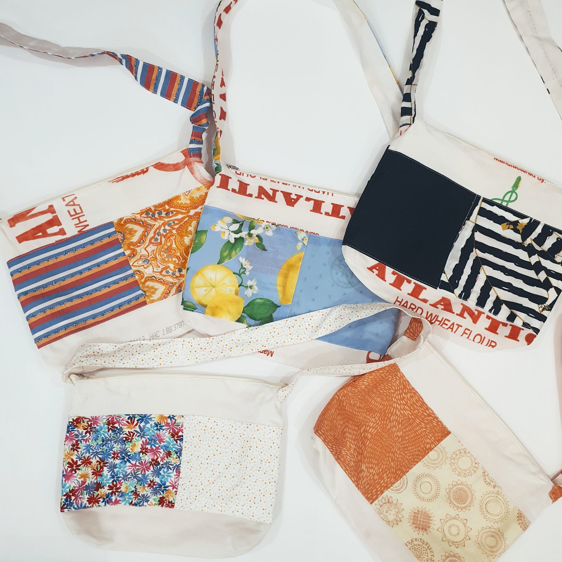 Atlantis Crossbody Sling: Crossbody sling bag pieced from upcycled flour sacks and deadstock fabric.